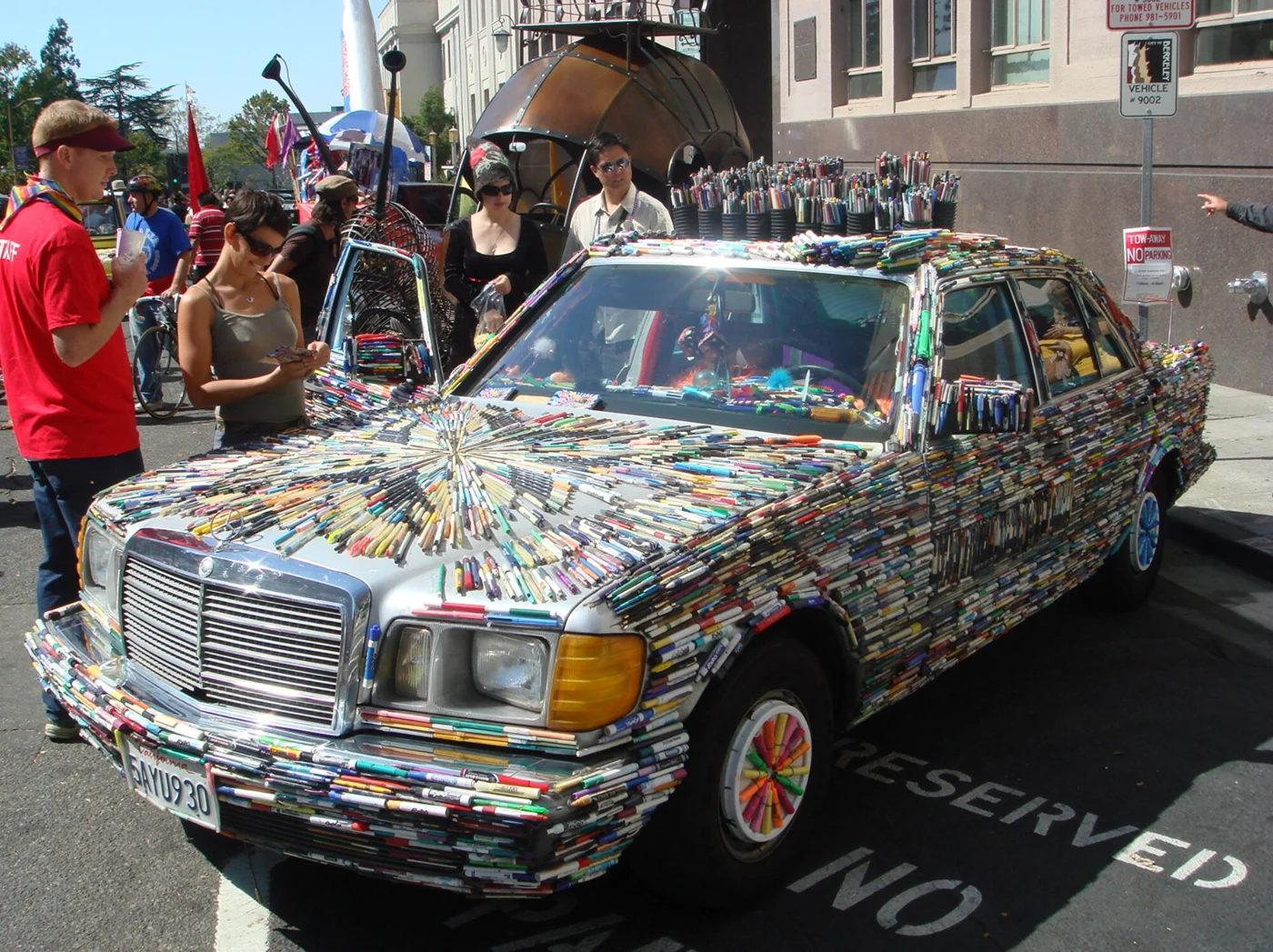 The Mercedes Pens art car covered with discarded pens at an outdoor event