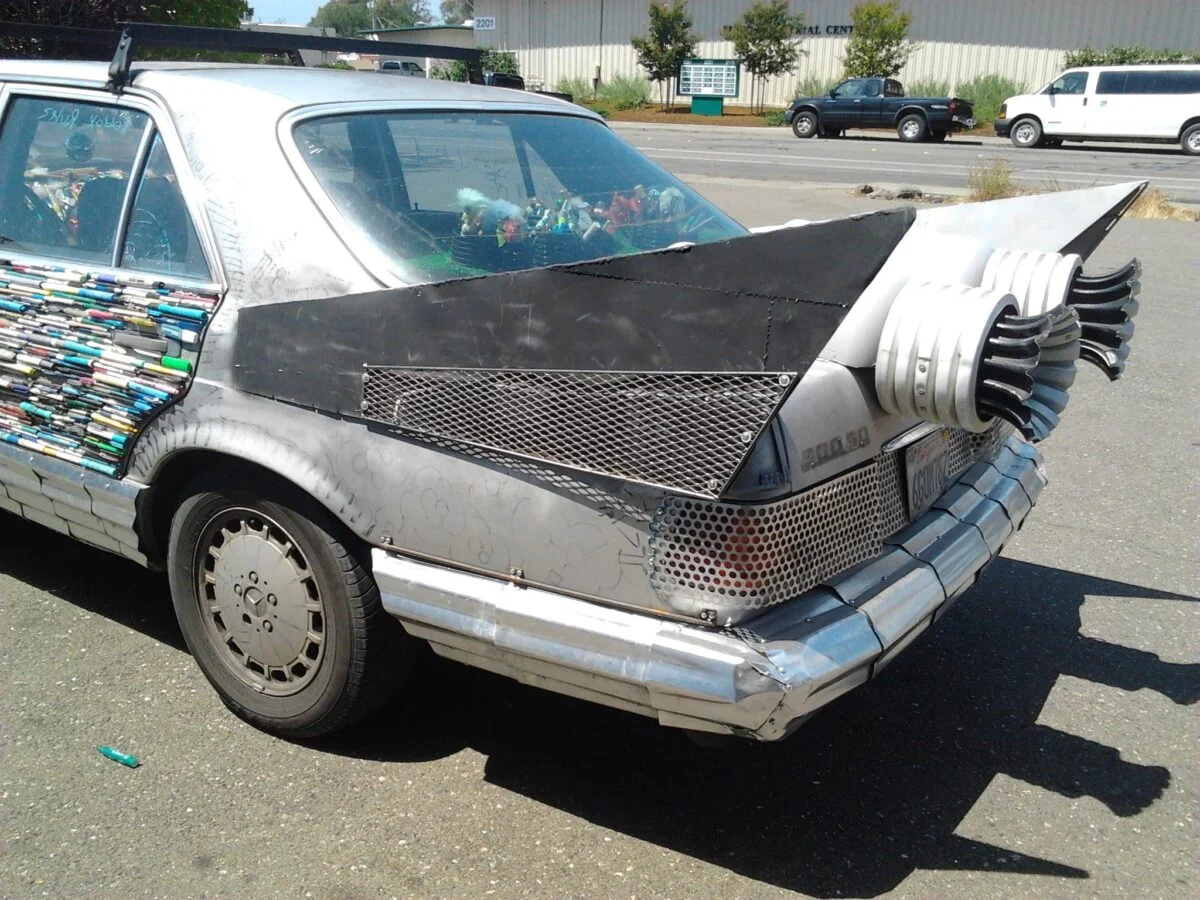 Fabricated metal fins and found-object details on Costas’s art car