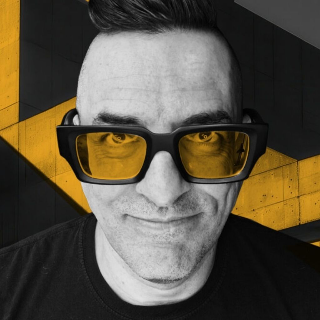 Costas Schuler wearing yellow-tinted glasses